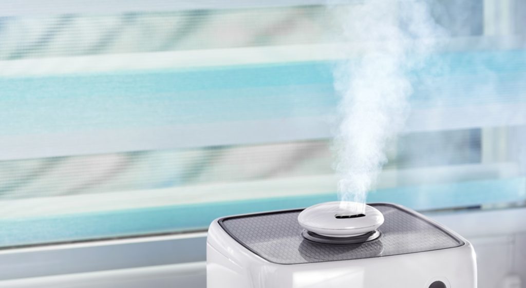 the-white-ultrasonic-humidifier-on-a-window-moiste-Y4M2Y8X
