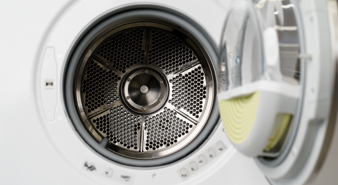 Close up photo of new dryer machine in household appliances store