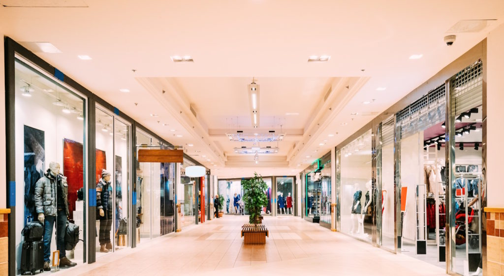 Shops with clothes at the modern shopping mall Shopping Centre.